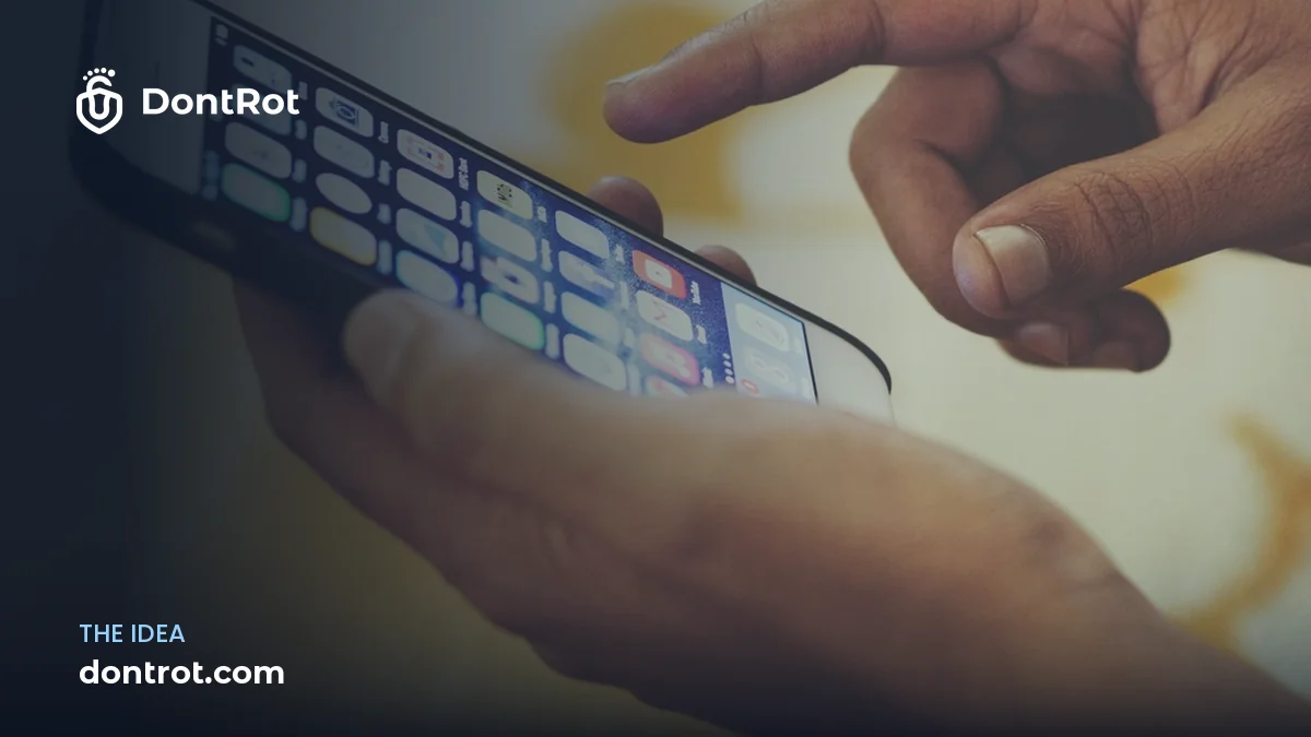 A hand reaching for a phone full of apps